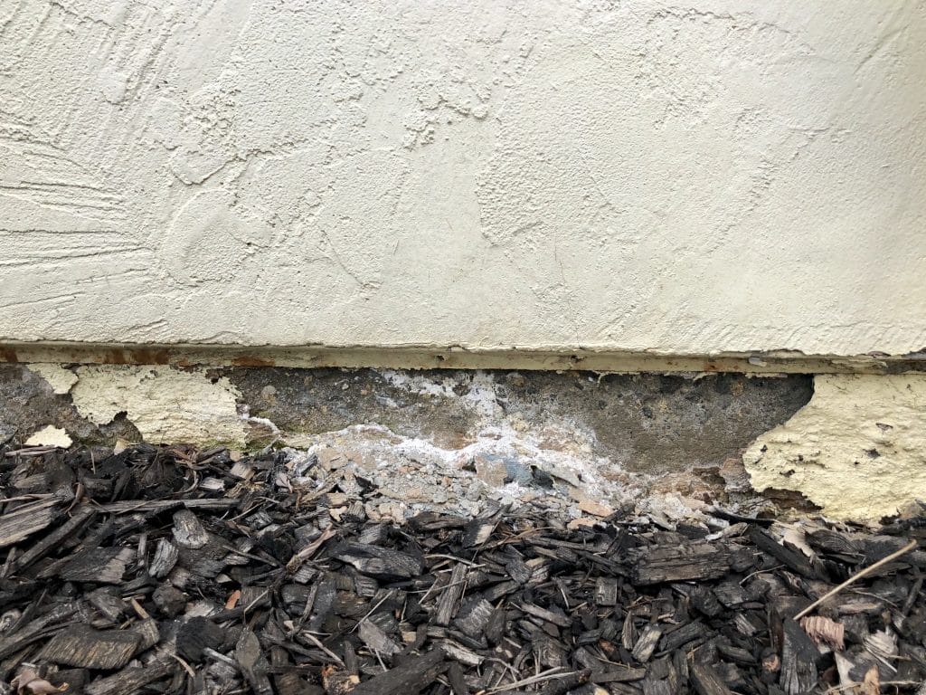 crumbling home foundation that serves as a warning sign to future sinkhole damage