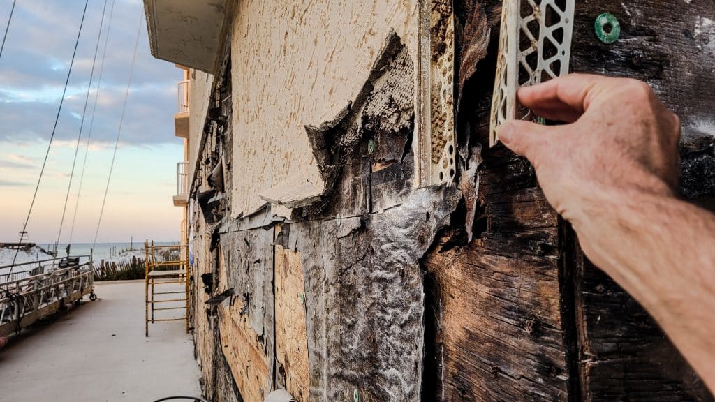 Man checking the extent of water damage to their home